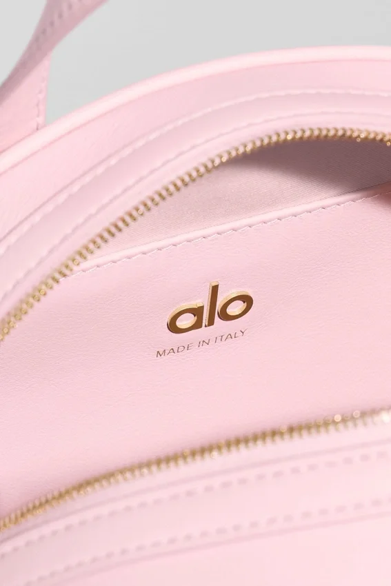 Alo Mini Odyssey – sonnenverwöhntes rosa Leder