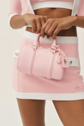 Alo Mini Voyage – sonnenverwöhntes rosa Leder