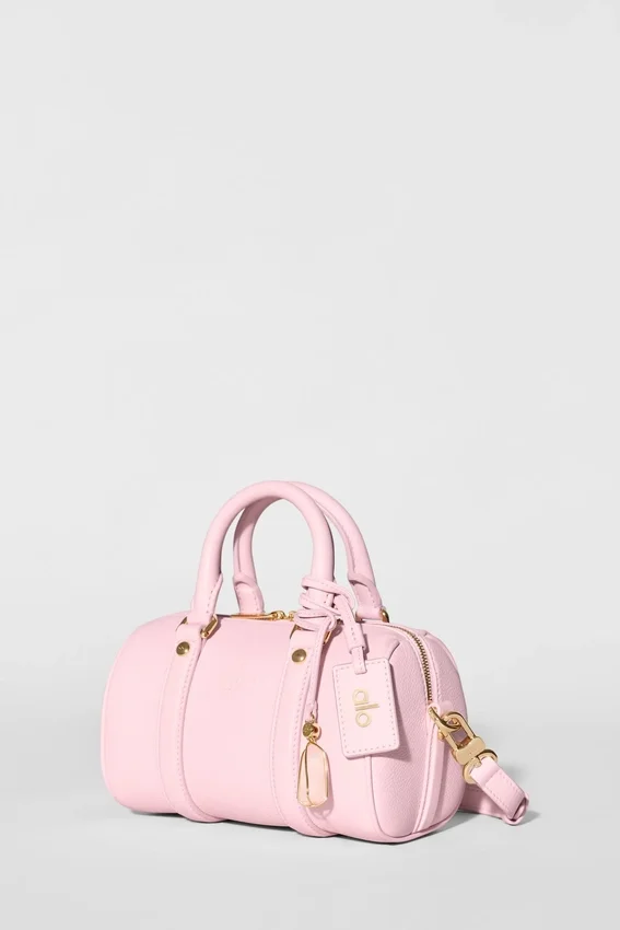 Alo Mini Voyage – sonnenverwöhntes rosa Leder