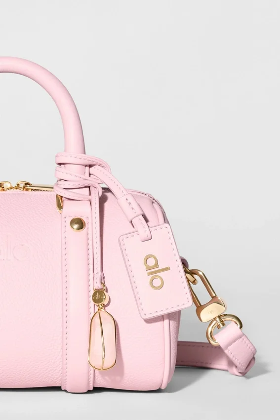 Alo Mini Voyage – sonnenverwöhntes rosa Leder