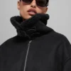 Grand-Jacke aus Kunstlammfell – Schwarz