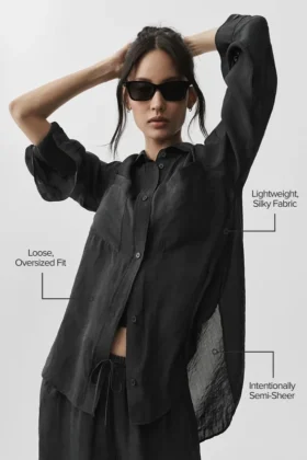 Halbtransparentes „Golden Hour“-Langarmshirt mit Knöpfen – Schwarz