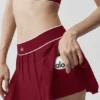 Tennisrock „Amp It up“ mit niedriger Leibhöhe – Summer Romance Red