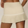 Tennisrock „My Serve“ aus Baumwolle und Kaschmir mit High-Waist-Taille – Sandy Beige/Weiß